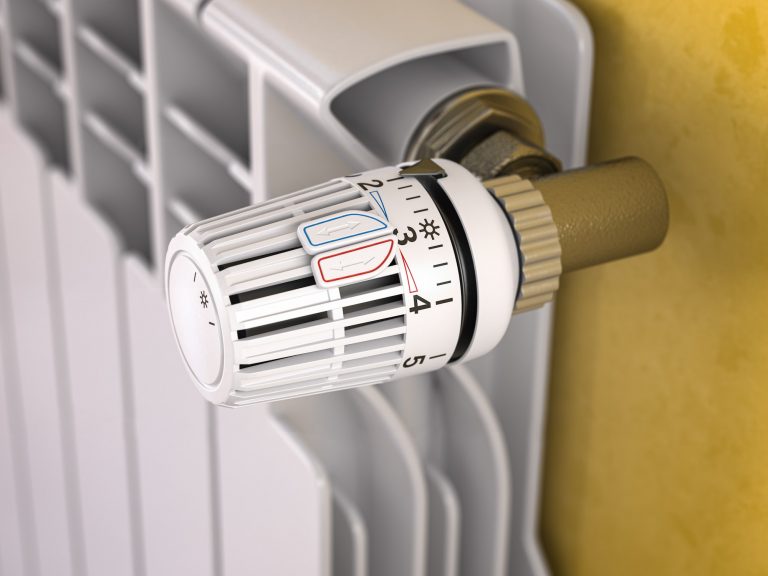 Thermostatic radiator valve close up. Temperature control and consumption saving