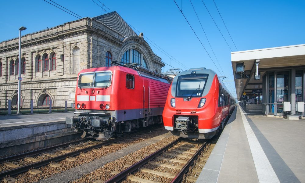 High speed train and old train on the railway station